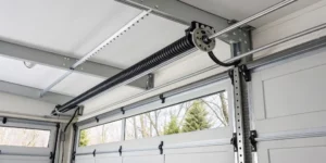 A dangerous garage door torsion spring, a warning against DIY repair.